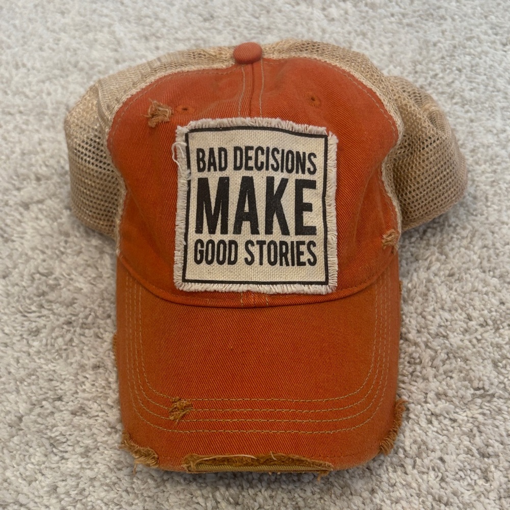 Distressed Orange Trucker Hat with 'Bad Decisions Make Good Stories' Patch